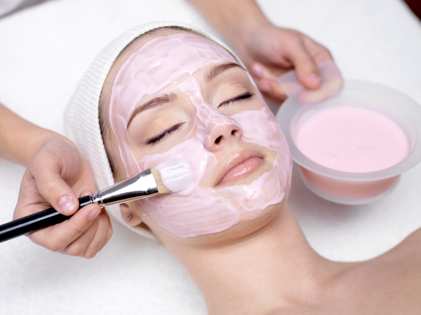 Girl Receiving Cosmetic Pink Facial Mask